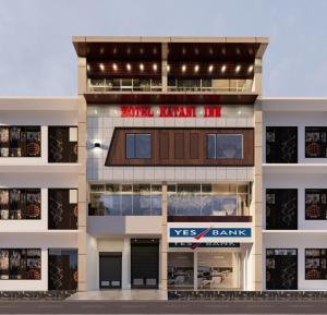 a large building with avs bank sign on it at Hotel Katani Inn in Kharar