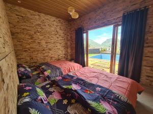 Postel nebo postele na pokoji v ubytování Villa Bintang Sikunir