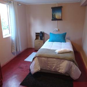 Ένα ή περισσότερα κρεβάτια σε δωμάτιο στο Homestay Pumagui