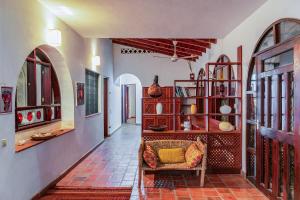 a living room with a couch and some shelves at Kipembeni 'Grounding' in Kilifi