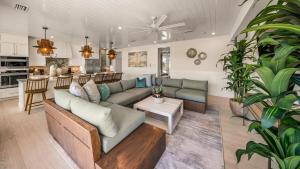 a living room with a couch and a table at Blue Lagoon in Siesta Key