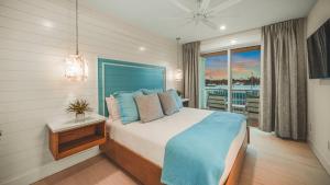 a bedroom with a bed and a view of a boat at Blue Lagoon in Siesta Key +53 photos