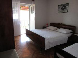 Posteľ alebo postele v izbe v ubytovaní Petar Apartments