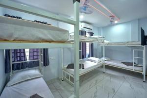 Postel nebo postele na pokoji v ubytování Panakal Residency, Fort Kochi