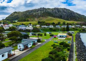a small town with a mountain in the background at Stanley Heritage House in Stanley +12 photos