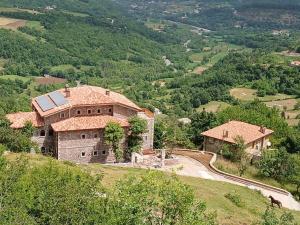 an aerial view of a house on a hill at Bujtina Çupa in Klos +67 photos