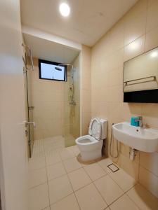 a bathroom with a toilet and a sink at The Apple Nice View Condo 16 in Melaka