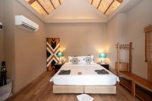 Postel nebo postele na pokoji v ubytování Tolani Resort Koh Kood