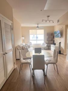 a living room with a table and chairs and a couch at Central Apartment in Los Angeles