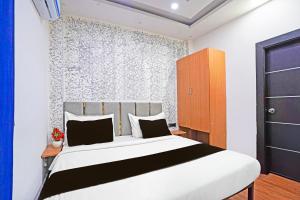 Postel nebo postele na pokoji v ubytování TWAMEV RESIDENCY