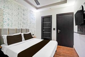 Postel nebo postele na pokoji v ubytování TWAMEV RESIDENCY + 30 fotografií