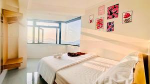 Ένα ή περισσότερα κρεβάτια σε δωμάτιο στο Villa Đà Lạt Trung Nghĩa