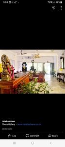 a picture of a large living room with at Hotel Ashiana in Siliguri