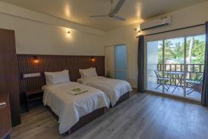 Voodi või voodid majutusasutuse Dhoadhi Beach Maldives toas