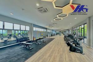 a gym with treadmills and exercise equipment in a building at Arena Residence KLIA Sepang With Netflix in Sepang