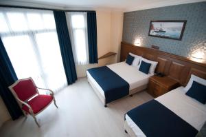 Postel nebo postele na pokoji v ubytování Artefes Hotel Old City