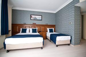 Postel nebo postele na pokoji v ubytování Artefes Hotel Old City