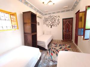 Postel nebo postele na pokoji v ubytování Riad Safir Fes Deluxe