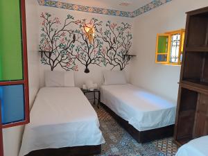 Postel nebo postele na pokoji v ubytování Riad Safir Fes Deluxe