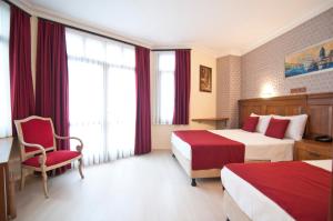 Postel nebo postele na pokoji v ubytování Artefes Hotel Old City