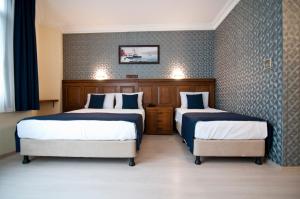 Postel nebo postele na pokoji v ubytování Artefes Hotel Old City