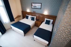 Postel nebo postele na pokoji v ubytování Artefes Hotel Old City
