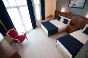 Postel nebo postele na pokoji v ubytování Artefes Hotel Old City