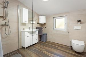 a bathroom with a sink and a toilet at Regina 1 in Banjole +14 photos