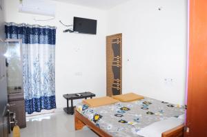Postel nebo postele na pokoji v ubytování Green Apple Resorts
