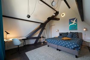 Postel nebo postele na pokoji v ubytování B&B Het Havenhuis