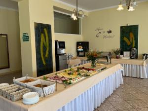 a buffet of food on a table in a room at Stokrotka Natura Tour in Karpacz