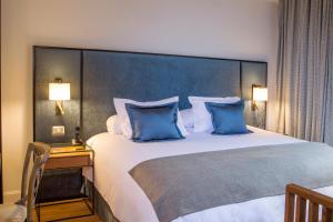 Postel nebo postele na pokoji v ubytování Hotel Luciano K