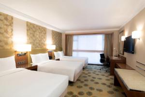Voodi või voodid majutusasutuse Holiday Inn Golden Mile by IHG toas