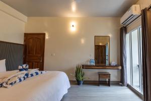 Voodi või voodid majutusasutuse Dhoadhi Beach Maldives toas