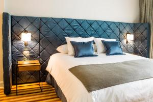 Postel nebo postele na pokoji v ubytování Hotel Luciano K