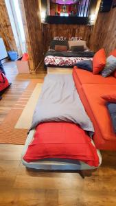 a group of beds sitting in a room at Romantic Room - Studio Jardin - Proche Disneyland Paris in Crecy la Chapelle