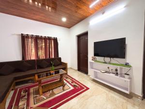 TV/trung tâm giải trí tại Riveria Eco-Village Munnar