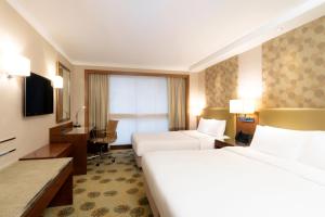 Voodi või voodid majutusasutuse Holiday Inn Golden Mile by IHG toas
