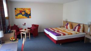 Postel nebo postele na pokoji v ubytování Andi´s Steakhüsli & Hotel