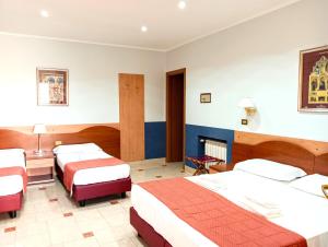 Postel nebo postele na pokoji v ubytování Hotel Riviera Fiumicino