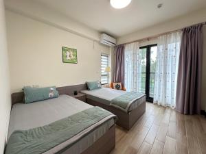 Postelja oz. postelje v sobi nastanitve Life With Bird Homestay