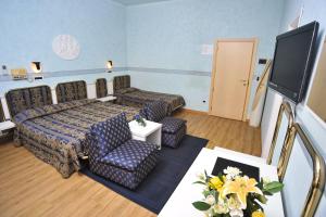 TV a/nebo společenská místnost v ubytování Hotel Massimo d'Azeglio
