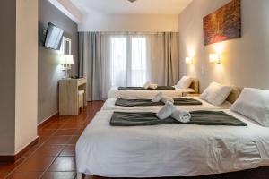 Postel nebo postele na pokoji v ubytování Scala Hotel