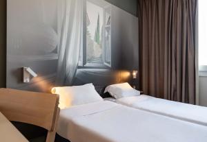 Postel nebo postele na pokoji v ubytování B&B HOTEL Valence TGV Romans