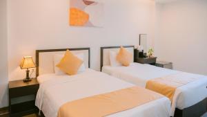 Postel nebo postele na pokoji v ubytování Horizon Front Beach Hotel Danang