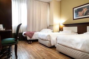 Postel nebo postele na pokoji v ubytování Hotel Alga + 37 fotografií