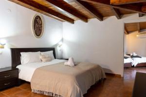 Voodi või voodid majutusasutuse Scala Hotel toas