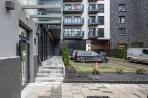 a car parked in front of a building at Apartament Botanique in Wrocław