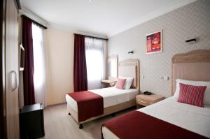 Postel nebo postele na pokoji v ubytování Artefes Hotel Old City