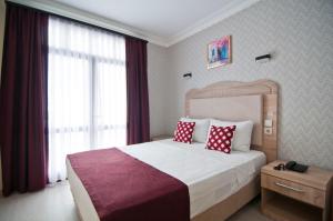 Postel nebo postele na pokoji v ubytování Artefes Hotel Old City